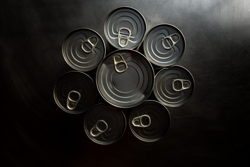 black and white round plastic containers