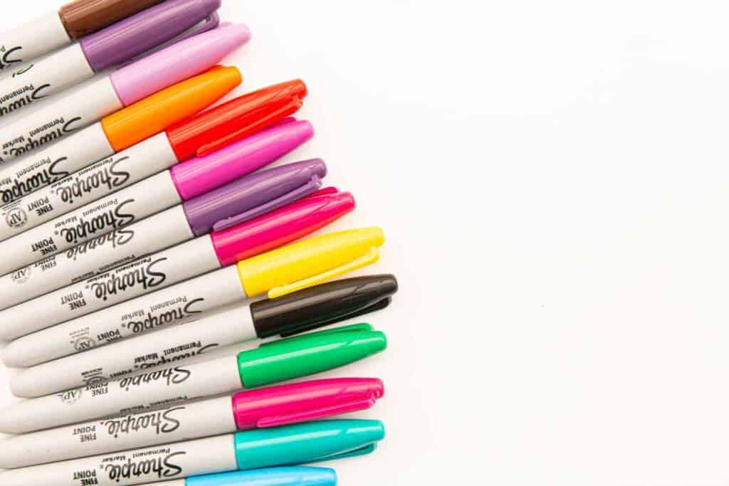 pink and purple pen with white background