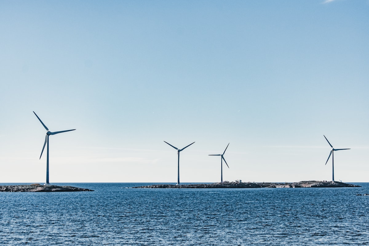 A row of wind turbines out at sea