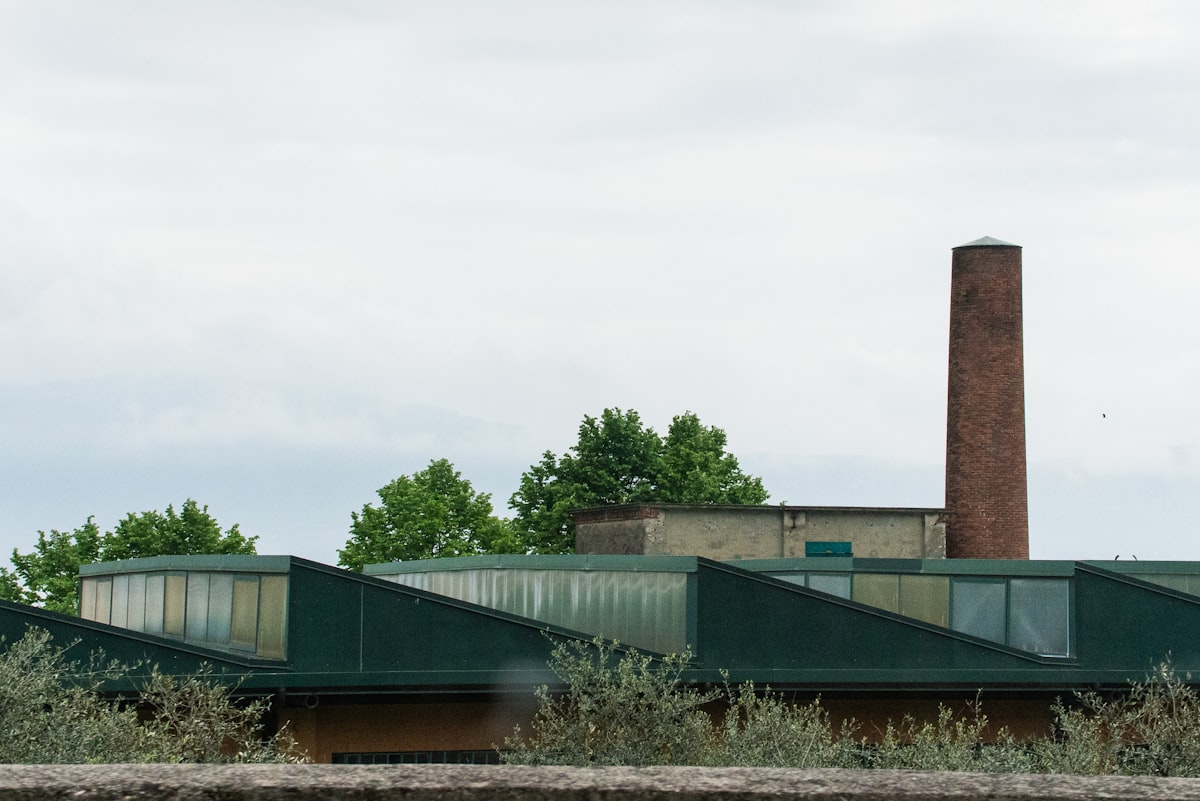 An industrial building with a tall chimney