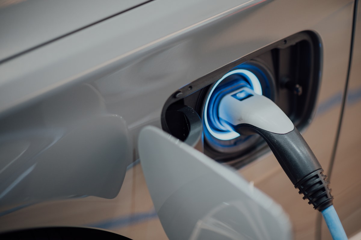 A charging cable plugged into an electric car