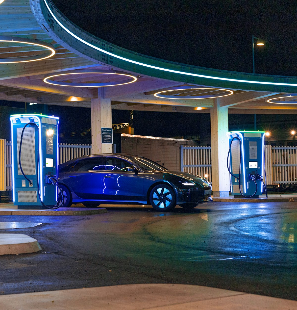 An electric car parked at a charging station