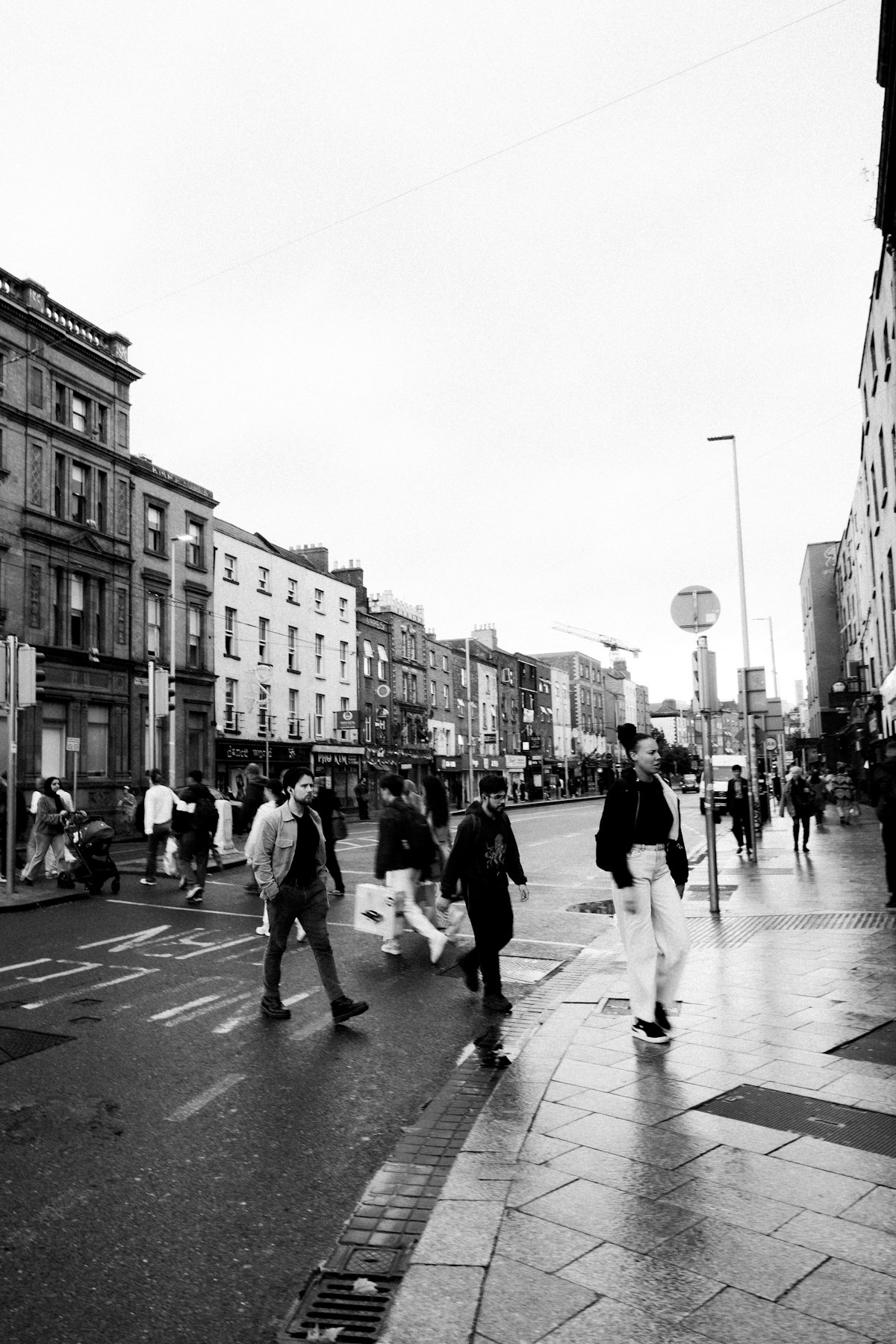 People walking along a busy street