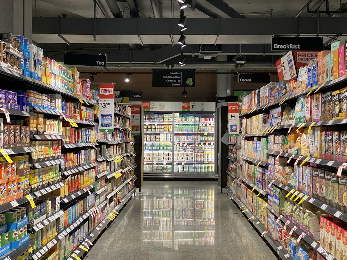A supermarket aisle full of food